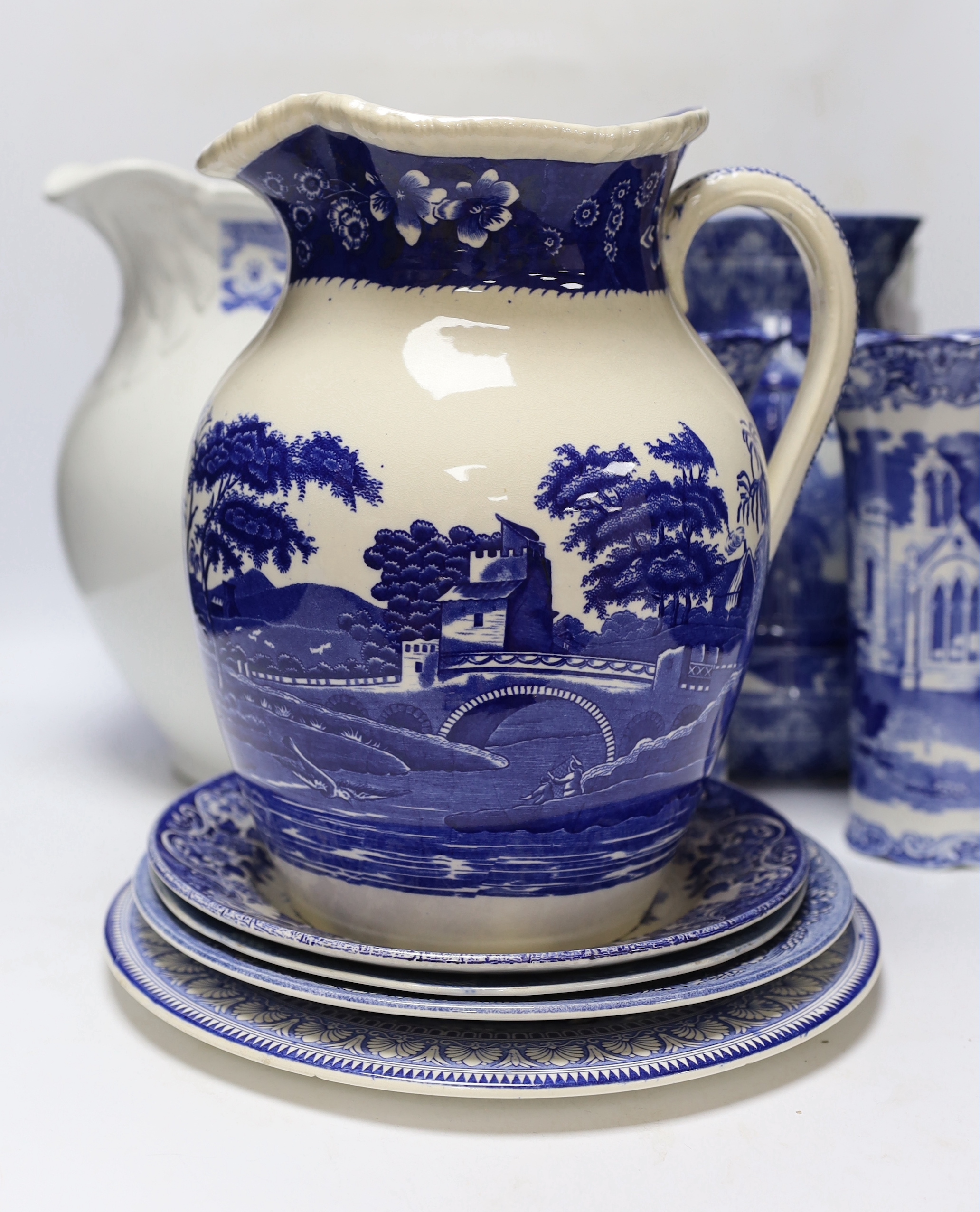 A quantity of blue and white plates, jugs, etc. including a large Spode Italian pattern jug, a George Jones Spanish costumes dish, a Cauldon ewer etc tallest 29cm (16)